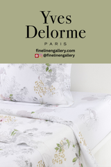 Palais Royal Linen Gallery Orchidée flat sheet in soft fabric, featuring a subtle floral pattern on a light-colored bed linen.