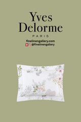 Yves Delorme Orchidée Sham featuring elegant floral embroidery on soft, luxurious fabric for a sophisticated bedroom decor.