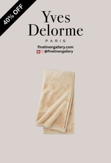 Palais Royal Linen Gallery Frisson Throw draped over a sofa, showcasing soft, textured fabric in neutral tones.