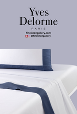 Yves Delorme Apollon duvet cover in Outremer with elegant floral pattern, shown with matching flat sheet.