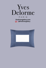 Yves Delorme Apollon Duvet Cover Outremer with intricate blue and white pattern, shown on a neatly made bed.