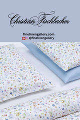 Cream-colored Florina flat sheet from Palais Royal Linen Gallery displayed flat, showcasing its smooth fabric and elegant design.