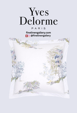 Yves Delorme Lande duvet cover with elegant shams featuring intricate embroidery in soft, neutral tones.