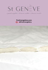 St. Geneve Piatra duvet with textured fabric and neutral color, displayed on a bed with pillows in a cozy bedroom setting.