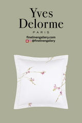 Elegant Gaura Shams in soft pastel colors from Palais Royal Linen Gallery, displayed on a neatly made bed with decorative pillows.